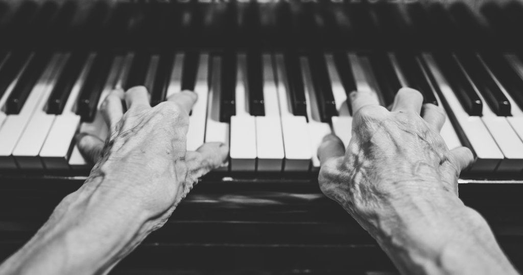 Photograph of man playing the piano