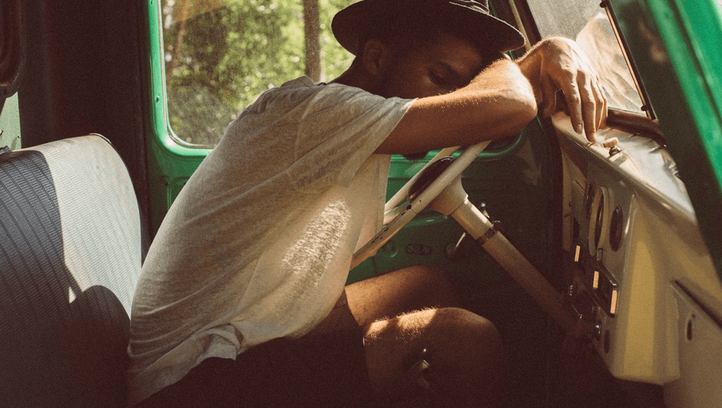man in truck not feeling well