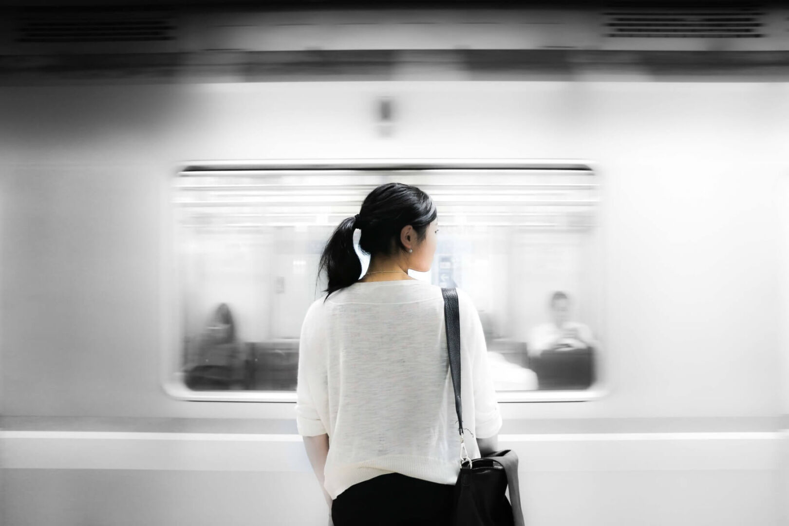 woman waiting for subway train
