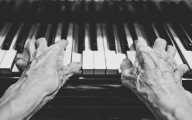 Photograph of man playing the piano