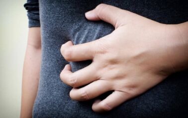 Photo of someone clenching their stomach